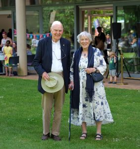 Two guests enjoying the garden party.