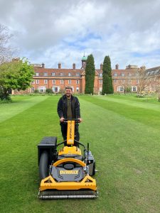 Deputy Head Gardener, Steve Hobson, mowing the College lawns with a battery powered lawn mower.