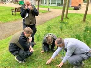 Gardening Team studying wildflowers in the gardens