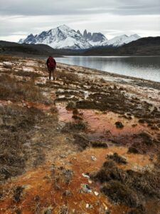 Seb walking along the Laguna Amarga, Cerro Almirante in the background