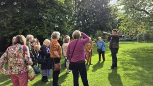 Alumni on garden tour with the Head Gardener