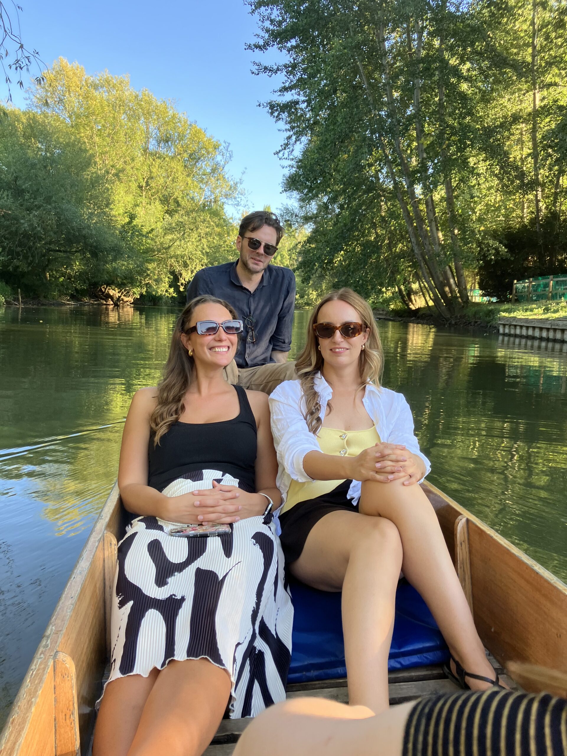 An image of three teachers in a punt on the river.