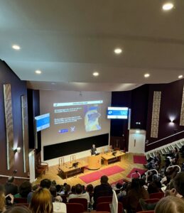 Professor Portugal presenting at the conference with image of gannet in background